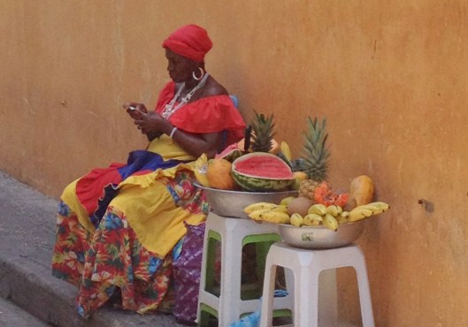 Afro-Caribbean woman selling exotic fruits