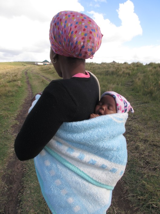 Local Xhosa woman carrying her baby